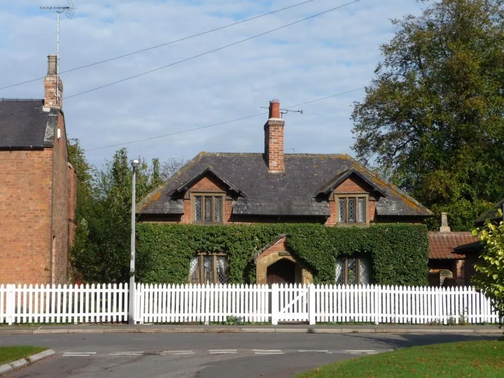 Traditional English cottage with gabled dormer windows