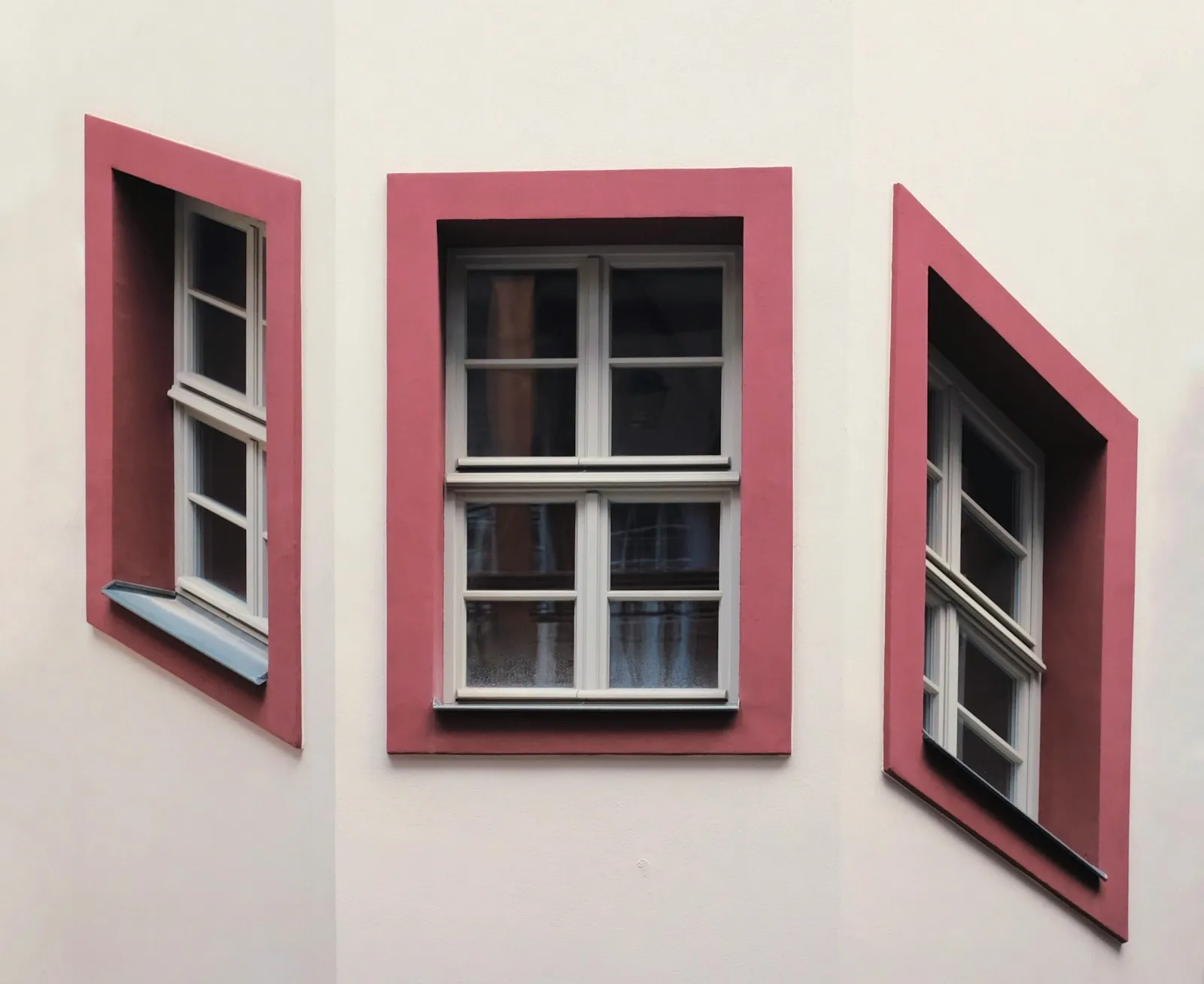 Classic white sash windows on a traditional UK brick building